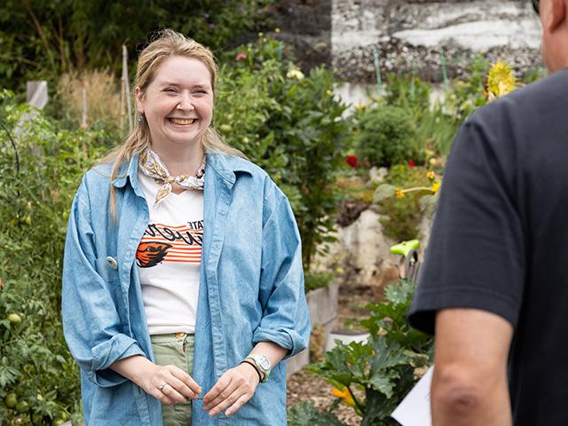 gardener talking to filming staff